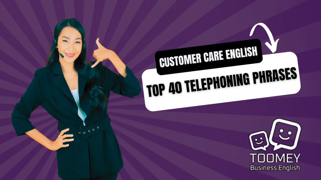 Asian businesswoman smiling and cups her hand to indicate telephone call with a customer | Toomey Business English